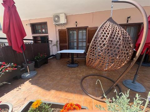 Terrace lounge with hanging chair